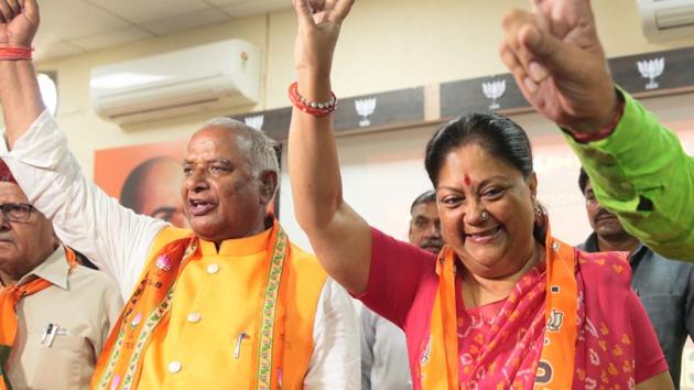 Former chief minister Vasundhara Raje and state president Madan Lal Saini show victory sign as they celebrate party's lead on the counting day of 2019 Lok Sabha elections, at BJP office, in Jaipur, on Thursday, May 23, 2019.(Himanshu Vyas / HT Photo)