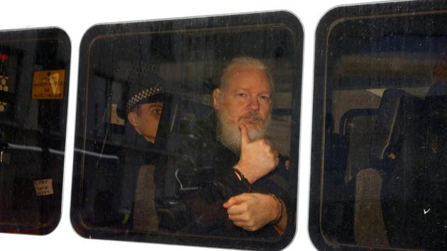 FILE PHOTO: WikiLeaks founder Julian Assange is seen in a police van after was arrested by British police outside the Ecuadorian embassy in London, Britain April 11, 2019. REUTERS/Henry Nicholls/File Photo(REUTERS)