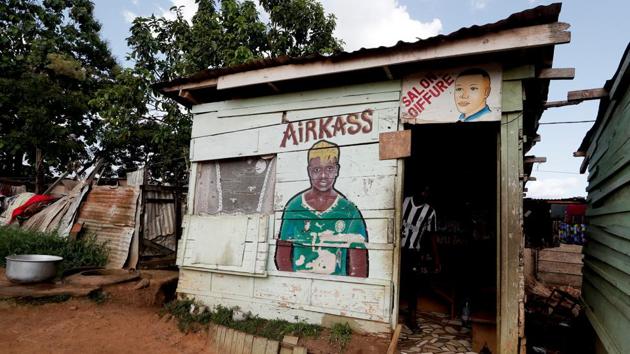 Gaelle Enganamouit is depicted on the facade of a hairdressers' shop in Yaounde. The Indomitable Lionessess’ star player, Gaelle Enganamouit, was the brains behind RFA - the West African country’s first female soccer academy. Her own experience as a young player in Yaounde showed her that it was important for women to have their own space to train, she told FIFA in January. (Zohra Bensemra / REUTERS) Gaelle Enganamouit is depicted on the facade of a hairdressers' shop in Yaounde. The Indomitable Lionessess’ star player, Gaelle Enganamouit, was the brains behind RFA - the West African country’s first female soccer academy. Her own experience as a young player in Yaounde showed her that it was important for women to have their own space to train, she told FIFA in January. (Zohra Bensemra / REUTERS)