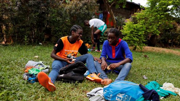 Gaelle Dule Asheri, and Ida Daniela Pouadjeu, 16, sit on the grass as they speak after a friendly match with male U15 in Yaounde,. Asheri, 17, and her teammate Pouadjeu, are now among the first wave of girls being trained by professional coaches at the Rails Foot Academy (RFA) in Yaounde. It was set up in January to foster female football talent in a country where many still see the sport as a man’s game. (Zohra Bensemra / REUTERS) Gaelle Dule Asheri, and Ida Daniela Pouadjeu, 16, sit on the grass as they speak after a friendly match with male U15 in Yaounde,. Asheri, 17, and her teammate Pouadjeu, are now among the first wave of girls being trained by professional coaches at the Rails Foot Academy (RFA) in Yaounde. It was set up in January to foster female football talent in a country where many still see the sport as a man’s game. (Zohra Bensemra / REUTERS)