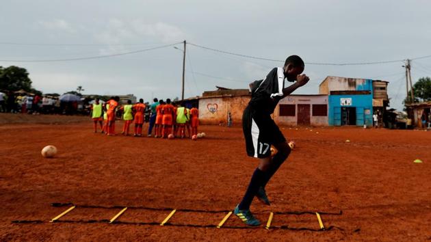 A girl football player, attends a training session at the RFA field in Yaounde. “I used to train with boys, so with boys there were some exercises I was not allowed to do because I am a girl,” Asheri said, describing how she was seen as more fragile than her male counterparts. (Zohra Bensemra / REUTERS) A girl football player, attends a training session at the RFA field in Yaounde. “I used to train with boys, so with boys there were some exercises I was not allowed to do because I am a girl,” Asheri said, describing how she was seen as more fragile than her male counterparts. (Zohra Bensemra / REUTERS)
