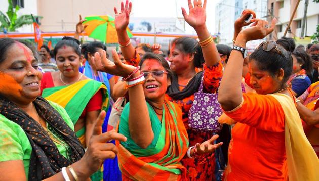BJP supporters celebrate the victory of party candidates in Lok Sabha elections by playing with colors in Agartala on Thursday.(ANI) BJP supporters celebrate the victory of party candidates in Lok Sabha elections by playing with colors in Agartala on Thursday.(ANI)
