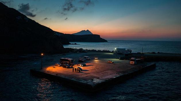 A general view of the port on the Greek Island of Anafi. With population 273, each ferry arrival is a notable event. (Angelos Tzortzinis / AFP)