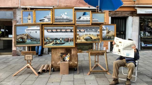 On May 22, 2019, Banksy posted an Instagram video that shows him setting up an unlicensed stall displaying a work of oil paintings titled "Venice in oil". The star of the clip is an unnamed man (perhaps it’s the artist himself) who is approached by local police to move his stall elsewhere. (Mara Gugliemi / AFP)