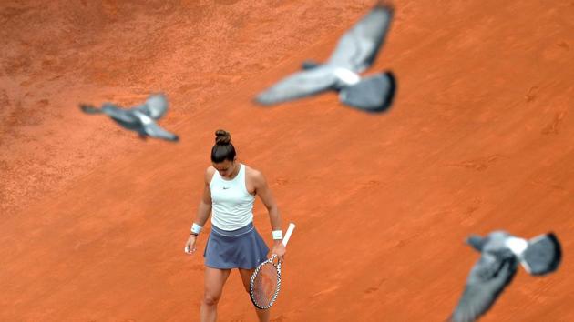 Pigeons fly over Greece’s Maria Sakkari during her WTA Masters tournament semi final tennis match against Czech Republic’s Karolina Pliskova at the Foro Italico camp in Rome. (Tiziana Fabi / AFP)