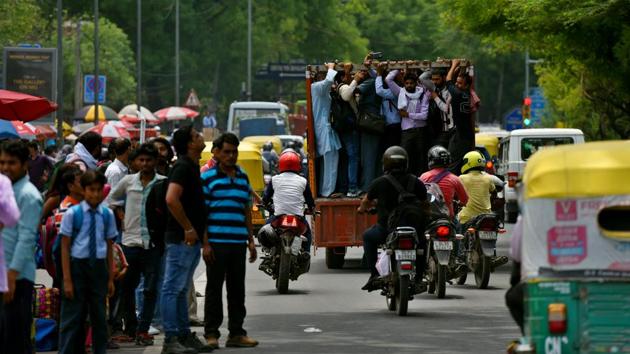 People crowd into a truck as an alternative after metro service operations on the Yellow Line were hit due to the breakdown of overhead wires between Sultanpur station and Qutub Minar Metro station, in New Delhi. (Amal KS / HT Photo) People crowd into a truck as an alternative after metro service operations on the Yellow Line were hit due to the breakdown of overhead wires between Sultanpur station and Qutub Minar Metro station, in New Delhi. (Amal KS / HT Photo)