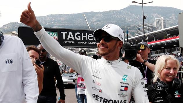 Mercedes' Lewis Hamilton celebrates qualifying in pole position.(REUTERS)
