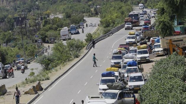 A massive landslide, triggered by incessant rains over the past two days, hit the Jammu-Srinagar National Highway in Ramban district in the wee hours of Saturday, leading to suspension of traffic on the only road linking Kashmir with rest of the country. Thousands of vehicles, which had left for Srinagar from here this morning, remain stranded on the highway following the closure of the road. (PTI) A massive landslide, triggered by incessant rains over the past two days, hit the Jammu-Srinagar National Highway in Ramban district in the wee hours of Saturday, leading to suspension of traffic on the only road linking Kashmir with rest of the country. Thousands of vehicles, which had left for Srinagar from here this morning, remain stranded on the highway following the closure of the road. (PTI)
