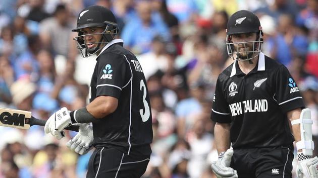New Zealand captain Kane Williamson, right, watches as teammate Ross Taylor celebrates scoring fifty. (AP)