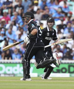New Zealand's Kane Williamson, right, and Ross Taylor run between the wickets to score during the Cricket World Cup warm up match between India and New Zealand at The Oval in London. (AP)
