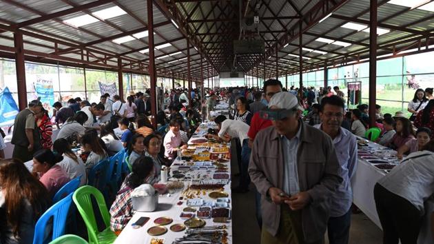 Sellers trade with buyers at the gems market in Mogok town. Specific sanctions were lifted after Aung San Suu Kyi’s government came to power in 2016. The industry remains tainted with a “reputation for corruption, conflict and deep connections to military-linked figures and armed groups”, says Paul Donowitz, of the watchdog Global Witness. (Ye Aung Thu / AFP)