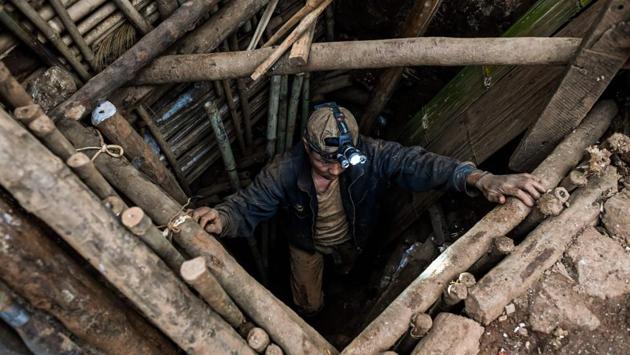 With no security protecting the sites, locals -- many former employees of the mining companies and long marginalised in the trade -- have rushed in to stake a claim. Now the openings of makeshift shafts, some just metres apart, pepper crowded sites, with teams working around the clock to bring up buckets of soil from depths of 30 metres (100 feet). (Ye Aung Thu / AFP)