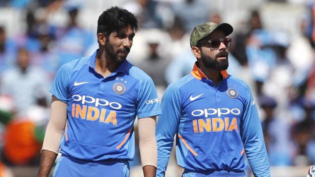 India's captain Virat Kohli, center, and Jasprit Bumrah (AP) India's captain Virat Kohli, center, and Jasprit Bumrah (AP)