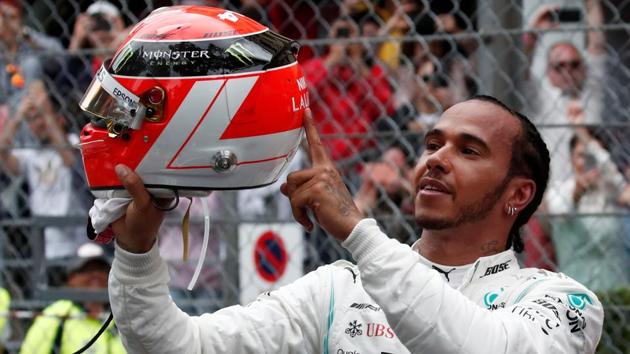 Mercedes' Lewis Hamilton celebrates winning the Monaco Grand Prix.(REUTERS)