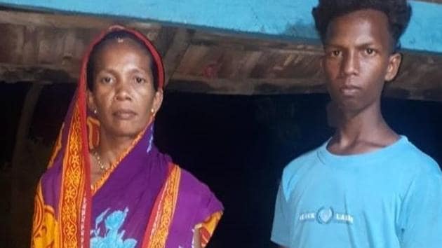 The tribal anganwadi worker in Malkangiri is seen here with her son.