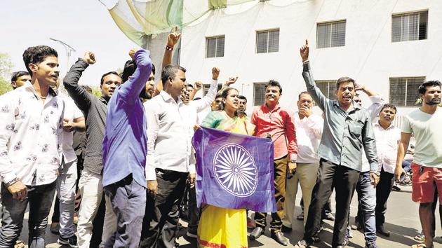 Members of Bhim Army shout slogans in support of the arrests of Sanjiv Gajanan Punalekar, advocate, and his associate Vikram Bhave, at the sessions court on Sunday.(Rahul Raut/HT PHOTO)