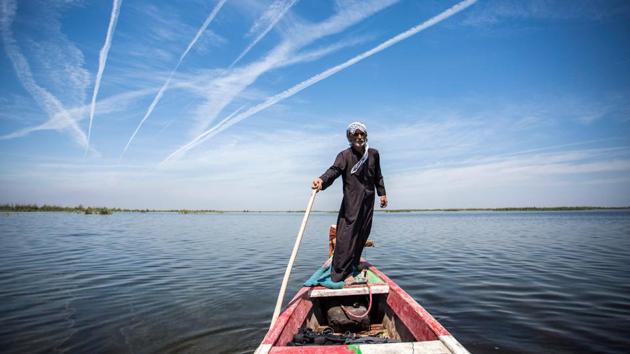 Abu Hayder, an ecotourism guide, navigates a canoe in the marshes of Chibayish in Iraq. “I didn’t think I would find somewhere so beautiful, and such a body of water in Iraq,” said Habib al-Jurani. He left Iraq in 1990 for the United States, and was back for a family visit. Looking around the lush marshes, declared in 2016 to be Iraq’s fifth UNESCO World Heritage site, Jurani added: “There are some mesmerising places.” (Hussein Faleh / AFP) Abu Hayder, an ecotourism guide, navigates a canoe in the marshes of Chibayish in Iraq. “I didn’t think I would find somewhere so beautiful, and such a body of water in Iraq,” said Habib al-Jurani. He left Iraq in 1990 for the United States, and was back for a family visit. Looking around the lush marshes, declared in 2016 to be Iraq’s fifth UNESCO World Heritage site, Jurani added: “There are some mesmerising places.” (Hussein Faleh / AFP)