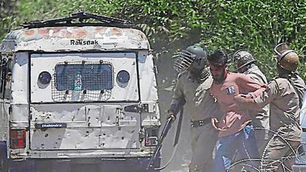 Indian policemen detain a Kashmiri youth who was protesting against the killing of Zakir Musa, a top militant commander linked to al-Qaida, in Srinagar (AP) Indian policemen detain a Kashmiri youth who was protesting against the killing of Zakir Musa, a top militant commander linked to al-Qaida, in Srinagar (AP)