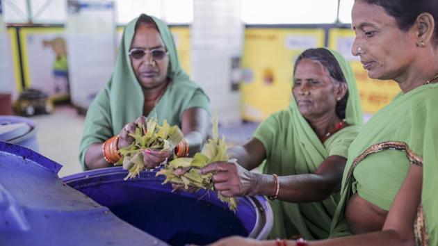 Krishna Devi and other women spread neem leaves in waste collection bins. She also helps make simple sanitary waste incinerators –not an ideal disposal method but a cleaner, more discreet option, prevalent in rural areas –at home. Devi says her work has brought a certain standing in the community. “And I won’t rest until every girl and woman in my village is able to have safe and healthy periods!” (WaterAid / Dhiraj Singh)