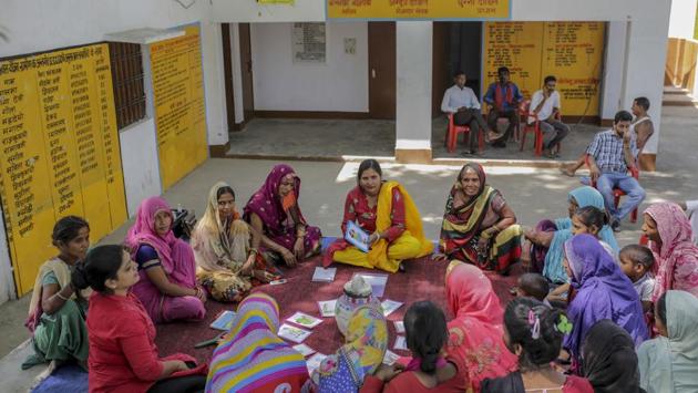 The conversation next veers on to how to prepare cloth pads for those who can’t afford sanitary napkins. “You can use any old cotton cloth for this,” says Anju, “but ensure that you wash it in disinfectant and dry in full sun!” A woman says that she is embarrassed to do this. Before Anju can respond, some of the other women tell her that periods are nothing to be ashamed of. (WaterAid / Dhiraj Singh)
