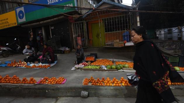 Street vendors at a marketplace in Aizawl Town, Mizoram. The state has once again become a “completely dry state” from Tuesday following a new liquor law that prohibits the sale and consumption of alcohol, the state’s Excise and Narcotics Minister K. Beichhua told IANS. He said that the state government would lose revenue to the tune of Rs 60 to Rs 70 crore annually following the decision. (Vipin Kumar / HT Archive) Street vendors at a marketplace in Aizawl Town, Mizoram. The state has once again become a “completely dry state” from Tuesday following a new liquor law that prohibits the sale and consumption of alcohol, the state’s Excise and Narcotics Minister K. Beichhua told IANS. He said that the state government would lose revenue to the tune of Rs 60 to Rs 70 crore annually following the decision. (Vipin Kumar / HT Archive)