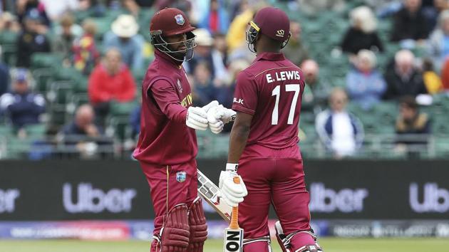 West Indies' Shai Hope, left, congratulates Evin Lewis after Lewis reaches his half century against New Zealand.(AP)