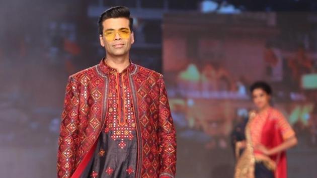 Mumbai: Filmmaker Karan Johar showcases a creation of fashion designer duo Abu Jani and Sandeep Khosla on the third day of Bombay Times Fashion Week Spring/ Summer 2019 in Mumbai, on March 25, 2019.(IANS)