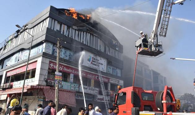A fire broke out on Friday at a coaching centre in Takshashila Complex, Surat, leaving 22 students dead. (HT photo) A fire broke out on Friday at a coaching centre in Takshashila Complex, Surat, leaving 22 students dead. (HT photo)