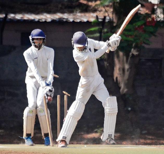 Tejas Tolsankar of Virag Cricket Academy clean bowled by Shlok Dharmadhikari of Deccan Gymkhana (not in picture) in the quarter-final of the Shivrampant Vishnu Damle trophy under-19 inter-club cricket tournament at the Katariya High School Ground on Tuesday.(RAVINDRA JOSHI/HT PHOTO)
