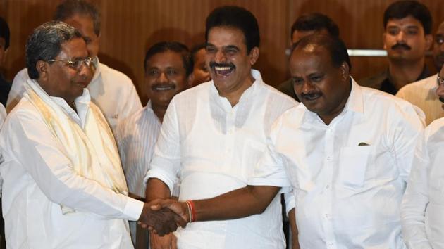 Congress leader K C Venugopal (centre) shares a light moment with chief minister HD Kumaraswamy and former CM Siddaramaiah.(Arijit Sen/HT Photo) Congress leader K C Venugopal (centre) shares a light moment with chief minister HD Kumaraswamy and former CM Siddaramaiah.(Arijit Sen/HT Photo)