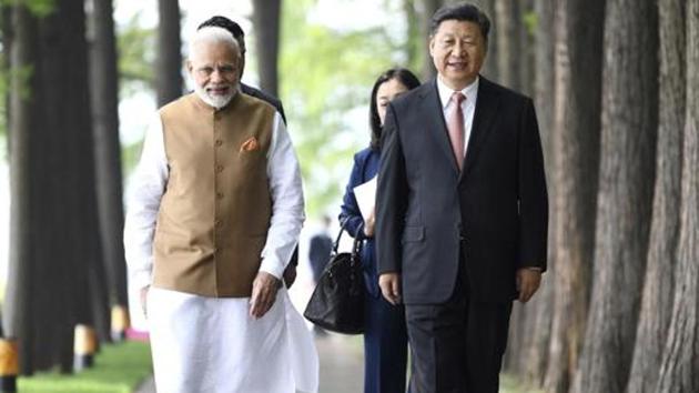 Prime Minister Narendra Modi and Chinese President Xi Jinping have met three times since Wuhan to “lead the waves of the two countries’ relations” and at least three Chinese ministers have visited India in the last one year.(AP PHOTO)