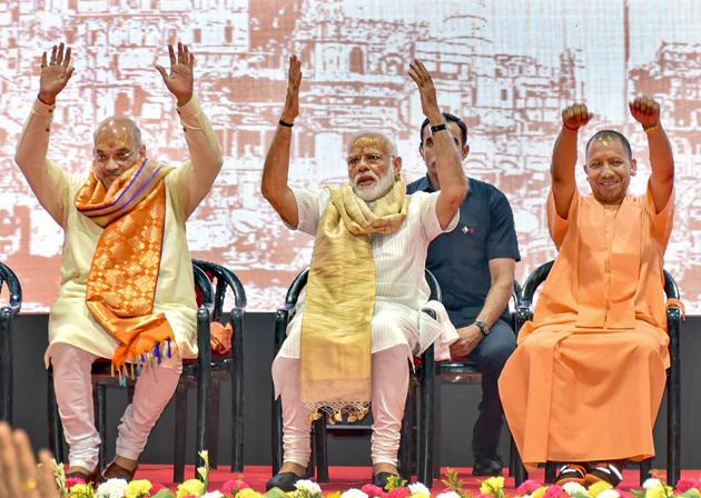 Prime Minister Narendra Modi with BJP President Amit Shah and UP chief minister Yogi Adityanath during a meeting with the party workers at Deen Dayal Upadhyay Hastkala Sankul in Varanasi, Monday, May 27, 2019.(PTI)