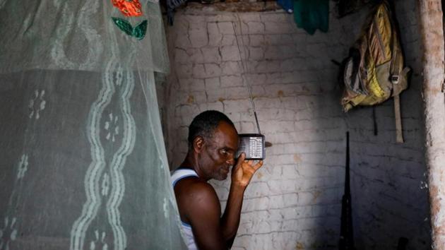 Jose listens to the radio inside his house, in Cairu. A battery-powered radio may be his principal connection to the outside world, but Cruz knows about global warming. “Nature is upset. ... In Antarctica, it’s melting, nature is melting... People, you have to have some awareness about what is happening. It’s clear what is happening,” he said. (Nacho Doce / REUTERS) 