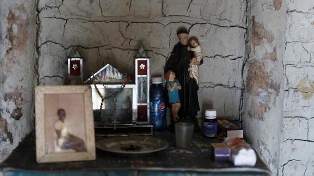 A shrine inside Jose and Vandeka Cruz’s house. Overfishing is likely a major reason for the decline in the crab and other fish populations as urban demand for seafood expands. Growing tourism has also led to the clearing of mangroves to make way for small inns and piers that pop up along the coast, further risking marine ecosystems and exacerbating the effects of climate change. (Nacho Doce / REUTERS) 