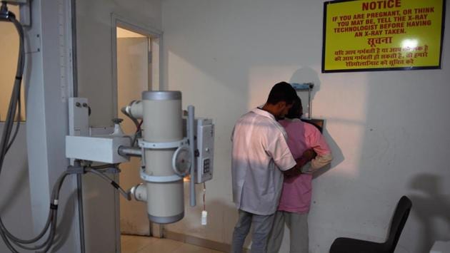 A patient is prepared for an X-ray. Even before Modicare was introduced in September, treatment was largely free at government hospitals. But patients still had to shell out for diagnostics and medicines, as well as for implants. Private clinics were out of reach for many, but now poorer Indians can visit these clinics, providing they sign up to the scheme. (Money Sharma / AFP) A patient is prepared for an X-ray. Even before Modicare was introduced in September, treatment was largely free at government hospitals. But patients still had to shell out for diagnostics and medicines, as well as for implants. Private clinics were out of reach for many, but now poorer Indians can visit these clinics, providing they sign up to the scheme. (Money Sharma / AFP)