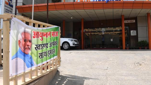 A banner for Ayushman Bharat, commonly known as “Modicare” at a hospital in Gurgaon. “It has certainly been welcomed as a welfare measure by the poor and probably contributed to electoral victory,” said K. Srinath Reddy, president of the non-profit Public Health Foundation of India. Modicare covers hospital costs up to Rs 5 lakh for the poorest 40% of Indians, in a country where the average annual income is little above Rs 1 lakh. (Money Sharma / AFP) A banner for Ayushman Bharat, commonly known as “Modicare” at a hospital in Gurgaon. “It has certainly been welcomed as a welfare measure by the poor and probably contributed to electoral victory,” said K. Srinath Reddy, president of the non-profit Public Health Foundation of India. Modicare covers hospital costs up to Rs 5 lakh for the poorest 40% of Indians, in a country where the average annual income is little above Rs 1 lakh. (Money Sharma / AFP)