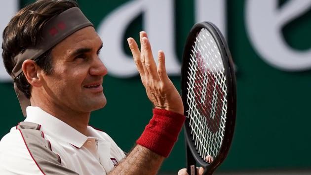 Roger Federer celebrates after reaching the third round at the French Open.(AFP)