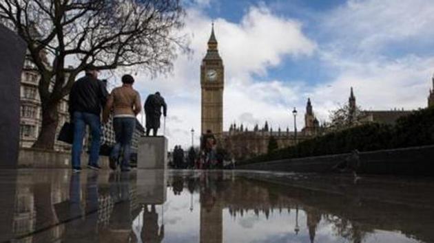 Pedestrians walk past a rainwater puddle reflecting the Houses of Parliament and the Elizabeth Tower, commonly referred to as Big Ben, in London, U.K. Image for representation (Bloomberg file photo) Pedestrians walk past a rainwater puddle reflecting the Houses of Parliament and the Elizabeth Tower, commonly referred to as Big Ben, in London, U.K. Image for representation (Bloomberg file photo)