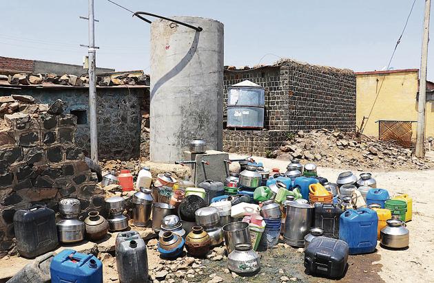 Empty vessels surround a public tap in Beed in the hope of water supply, of which there is close to none this summer. (Aamir Hussain/HT Photo) Empty vessels surround a public tap in Beed in the hope of water supply, of which there is close to none this summer. (Aamir Hussain/HT Photo)