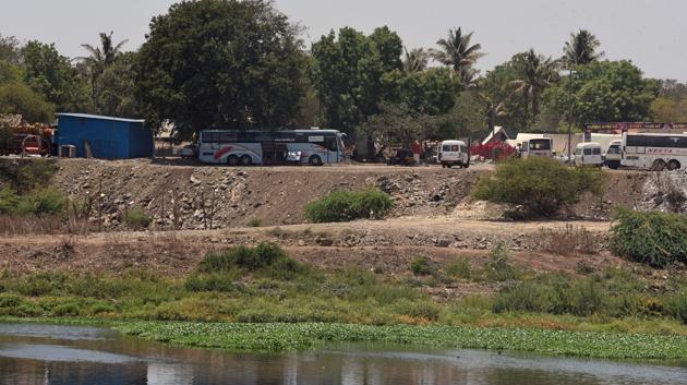 On Wednesday, Hindustan Times published a report about a large portion of Mula riverside land encroached by dumping debris (Pratham Gokhale/HT Photo) On Wednesday, Hindustan Times published a report about a large portion of Mula riverside land encroached by dumping debris (Pratham Gokhale/HT Photo)