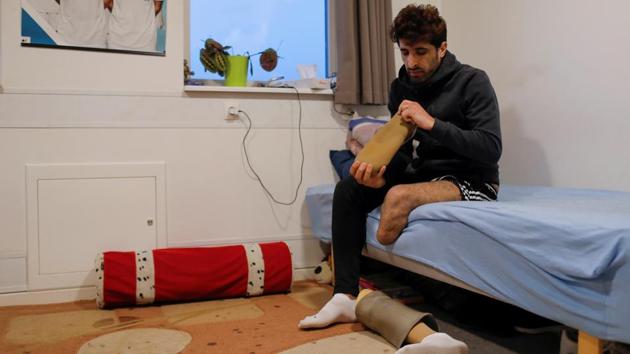 Hoshang Rostami, 25, is one of the many Iranian refugees in Kaershovedgaard. In his four years in Denmark, authorities have housed him in five different centres. He says he feels distrusted by Danish authorities, who have doubted he lost part of his leg due to a landmine accident. “They told me my papers of imprisonment and political activities in Iran were fake.” (Andrew Kelly / REUTERS) Hoshang Rostami, 25, is one of the many Iranian refugees in Kaershovedgaard. In his four years in Denmark, authorities have housed him in five different centres. He says he feels distrusted by Danish authorities, who have doubted he lost part of his leg due to a landmine accident. “They told me my papers of imprisonment and political activities in Iran were fake.” (Andrew Kelly / REUTERS)