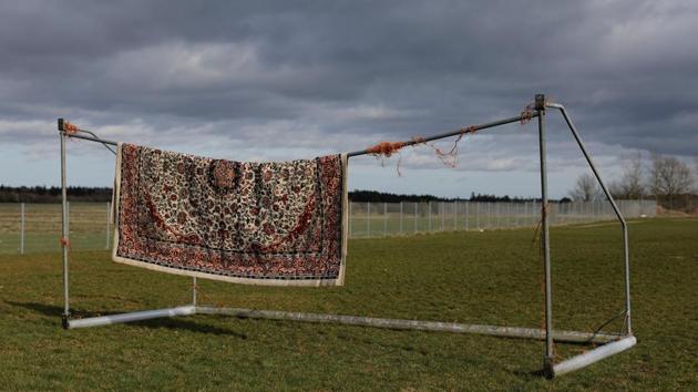 A rug belonging to a resident from Iran hangs from a football goalpost to dry. Yasaman Paknejad, 36, came to Denmark from Iran to study. She said she is a refugee based on the political situation in Iran, but her asylum case was rejected. “I have no freedom in here, and it is breaking me down mentally. Regular prisoners know when they will be set free, so this is far worse than being in prison.” (Andrew Kelly / REUTERS) A rug belonging to a resident from Iran hangs from a football goalpost to dry. Yasaman Paknejad, 36, came to Denmark from Iran to study. She said she is a refugee based on the political situation in Iran, but her asylum case was rejected. “I have no freedom in here, and it is breaking me down mentally. Regular prisoners know when they will be set free, so this is far worse than being in prison.” (Andrew Kelly / REUTERS)