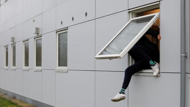 A resident climbs through a window. What makes the return process so lengthy and uncertain is that often home countries refuse to accept people back, refuse to issue them a passport or question their nationality. “The authorities do not believe our stories, but how should we prove them? I cannot ask those who want to kill me for a piece of paper with a confirmation,” Christensen said. (Andrew Kelly / REUTERS) A resident climbs through a window. What makes the return process so lengthy and uncertain is that often home countries refuse to accept people back, refuse to issue them a passport or question their nationality. “The authorities do not believe our stories, but how should we prove them? I cannot ask those who want to kill me for a piece of paper with a confirmation,” Christensen said. (Andrew Kelly / REUTERS)