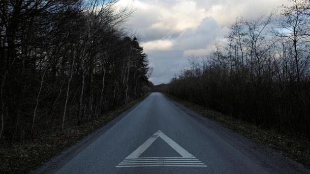 A marker on the road points toward Kaershovedgaard. “You can’t just pick and choose in Denmark. That is why we need to put pressure on these people to take responsibility and return home. They are not entitled to be here,” Danish minister of immigration and integration Inger Stojberg told Berlingske newspaper in January referring to the departure centres. (Andrew Kelly / REUTERS) A marker on the road points toward Kaershovedgaard. “You can’t just pick and choose in Denmark. That is why we need to put pressure on these people to take responsibility and return home. They are not entitled to be here,” Danish minister of immigration and integration Inger Stojberg told Berlingske newspaper in January referring to the departure centres. (Andrew Kelly / REUTERS)