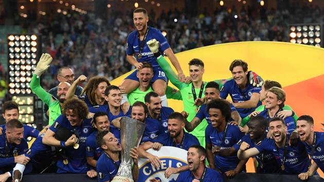 Chelsea players celebrate with the trophy after winning the UEFA Europa League final football match between Chelsea FC and Arsenal FC at the Baku Olympic Stadium in Baku, Azerbaijian, on May 29, 2019.(AFP)