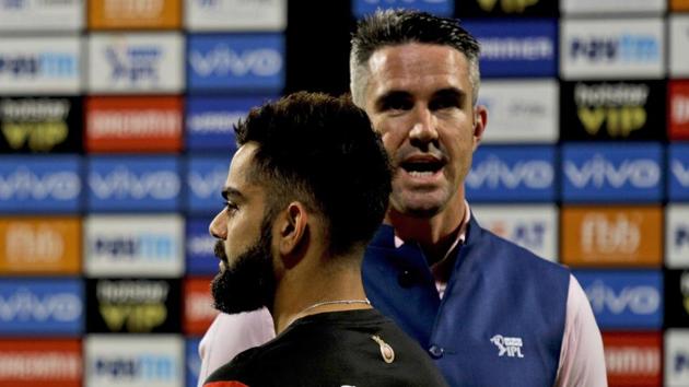 Royal Challengers Bangalore's Virat Kohli, foreground, talks with former England cricket captain Kevin Pietersen before the start of the VIVO IPL cricket T20 match against Kolkata Knight Riders in Kolkata, India, Friday, April 19, 2019.(AP)