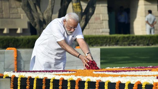 Prime Minister--elect Narendra Modi began his day by paying respects to Mahatma Gandhi at Rajghat and Atal Bihari Vajpayee at the Sadaiv Atal Samadhi and to soldiers killed in the line of duty at the National War Memorial ahead of his swearing--in ceremony today evening at the Rashtrapati Bhawan. (Ajay Aggarwal / HT Photo)
