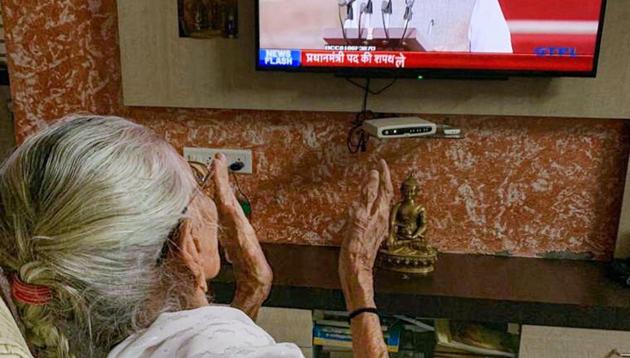 Prime Minister Narendra Modi's mother Hiraba watches him on television as he takes oath of office and secrecy for the second term, at her residence in Gandhinagar, Thursday, May 30, 2019.(PTI photo) Prime Minister Narendra Modi's mother Hiraba watches him on television as he takes oath of office and secrecy for the second term, at her residence in Gandhinagar, Thursday, May 30, 2019.(PTI photo)