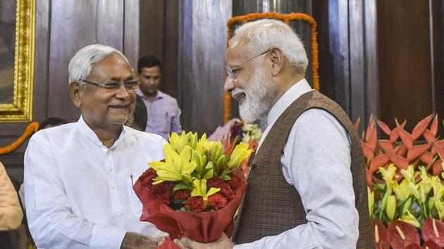 Prime Minister Narendra Modi being greeted by Chief Minister of Bihar Nitish Kumar during the NDA parliamentary board meeting, at Central Hall of Parliament House, in New Delhi, Saturday, May 25, 2019.(PTI)