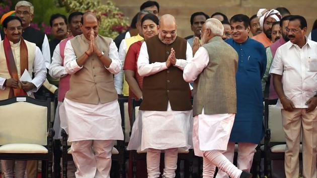 Prime Minister Narendra Modi greets Bharatiya Janata Party leaders Amit Shah, Rajnath Singh, Nitin Gadkari and others on their arrival for the swearing-in ceremony, at Rashtrapati Bhavan, in New Delhi, India, on Thursday, May 30, 2019.(Ajay Aggarwal/HT PHOTO)